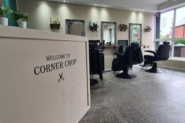 The Welcome to Corner Chop sign at the desk