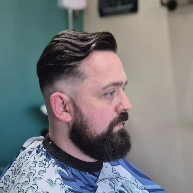A side part and beard at Corner Chop